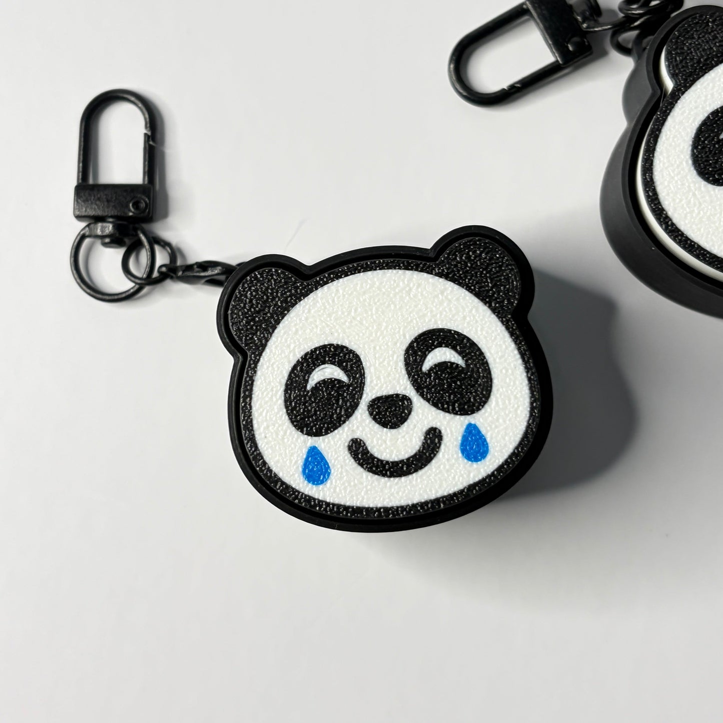 crying laughing panda fidget keychain