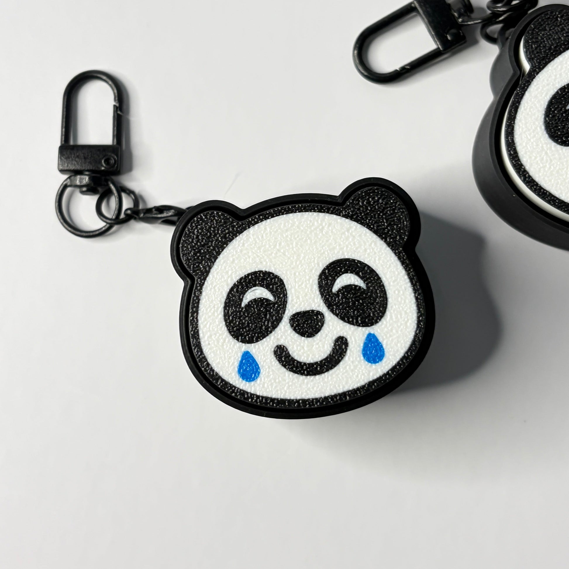 crying laughing panda fidget keychain